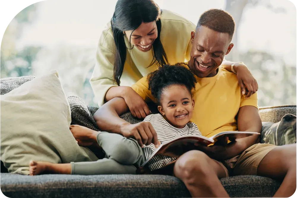 Happy family reading a book in pest free home in Florida