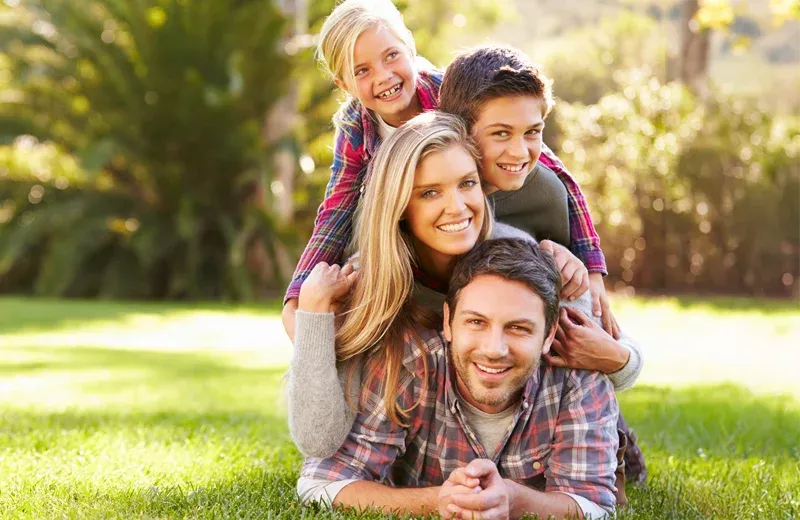 family playing outside in mosquito free yard